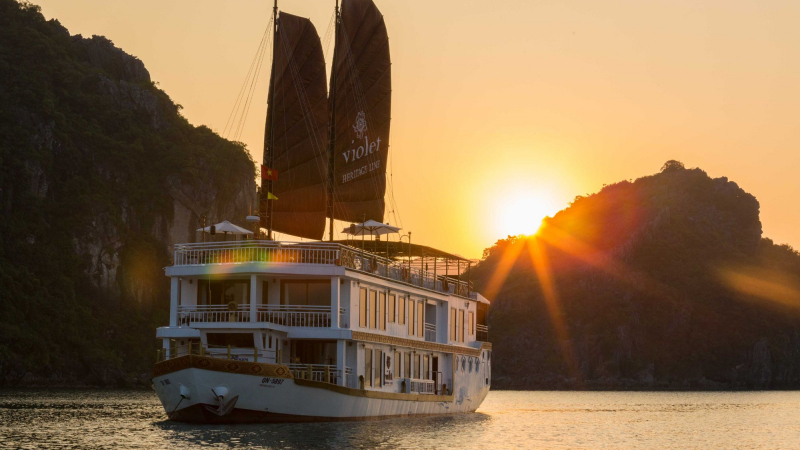 Heritage romantic junk boat among stunning sunset