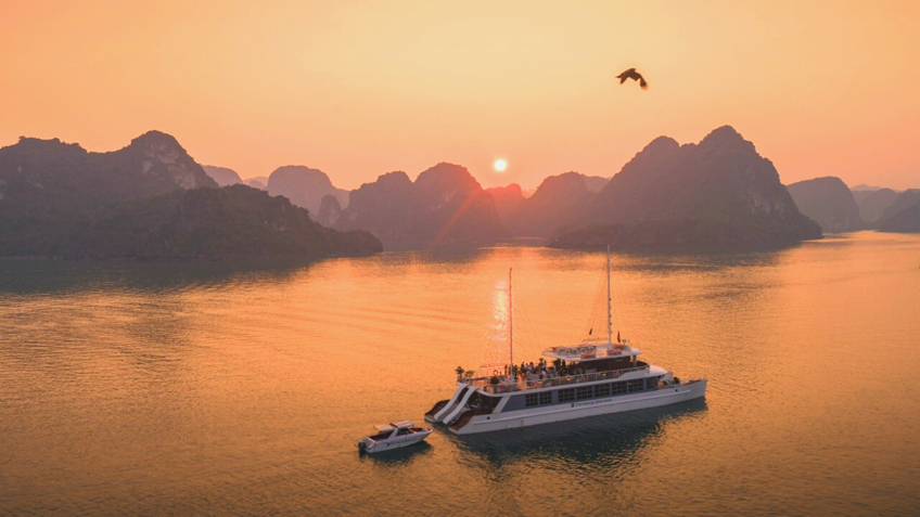 A Lovely Catamaran In The Romantic Sunset of Cat Ba