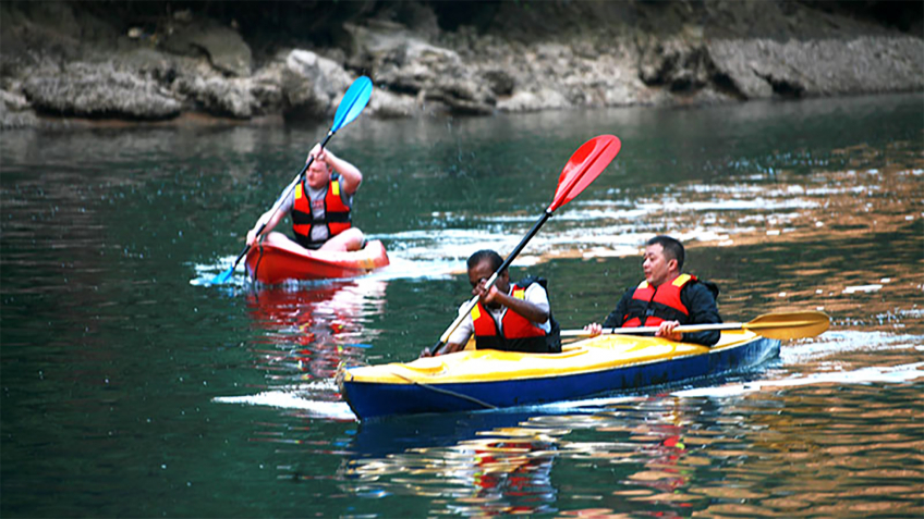 Kayaking On The Tranquil Water Of Halong Bay