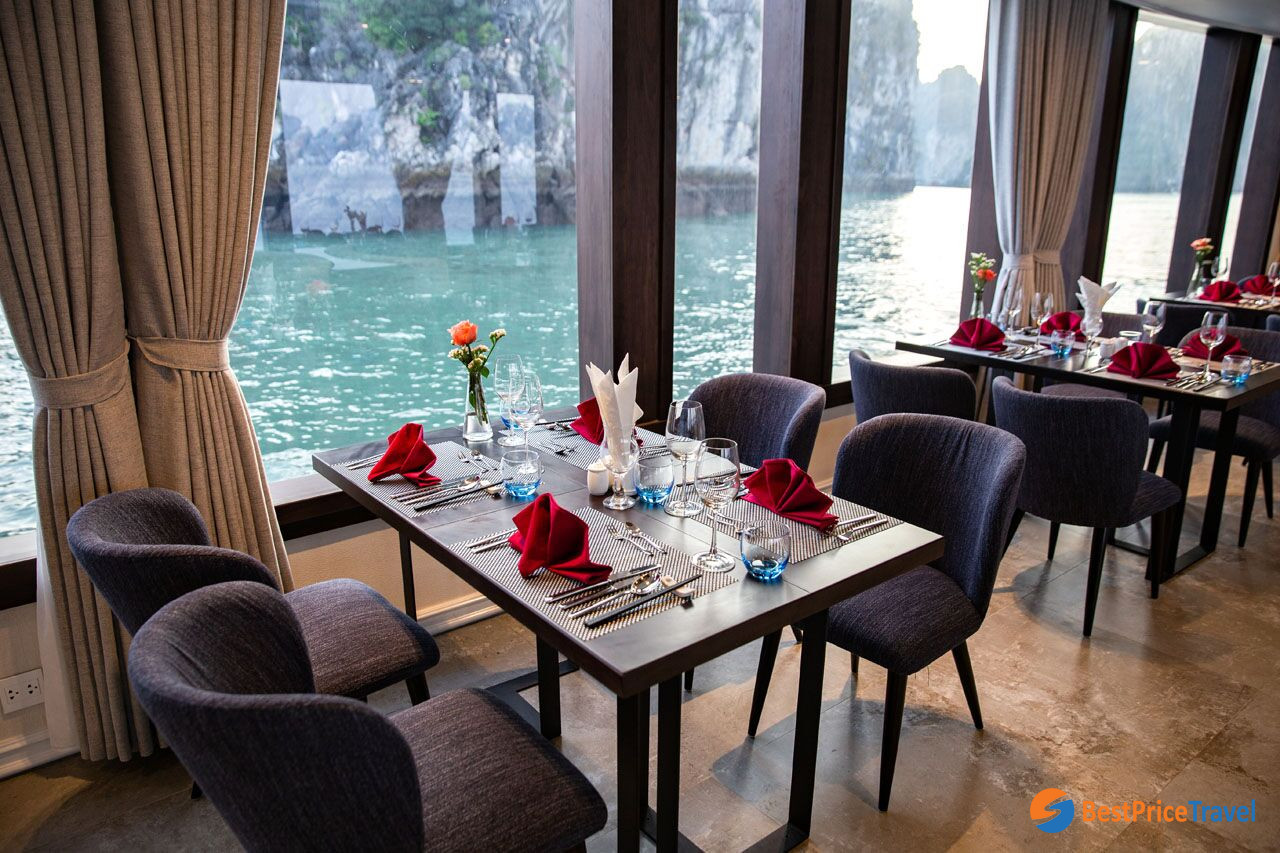Luxury restaurant on board with elegant dining table sets