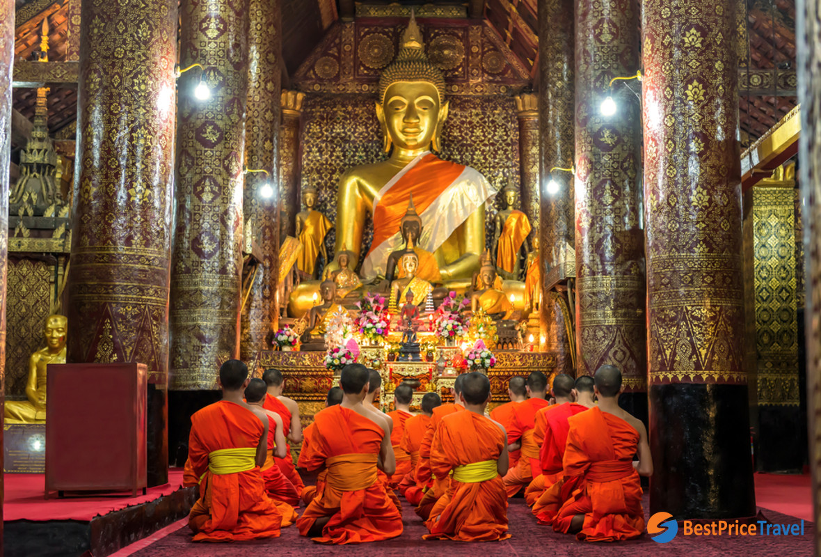 The monks are praying in the temple hall