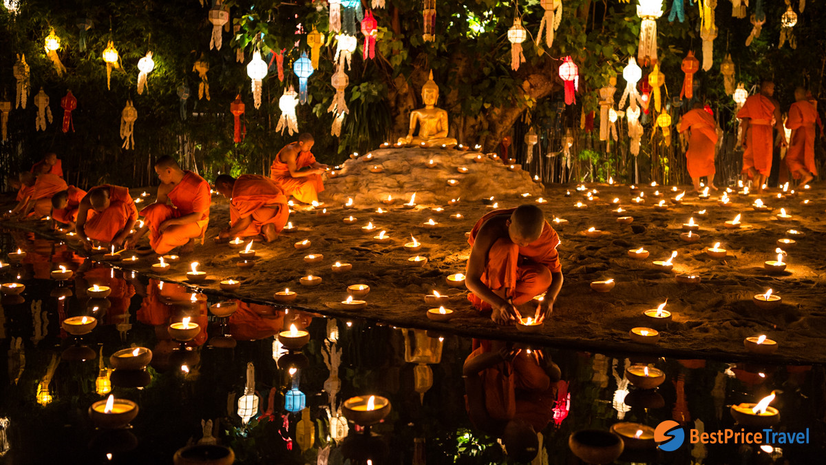 Candles are floating on the river in Thailand Khao Phan Sa festival