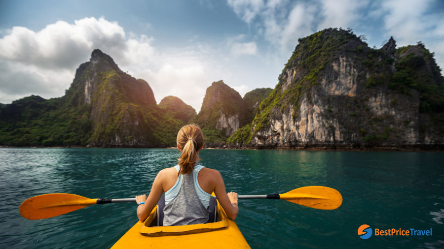 Kayaking offers breathtaking travel photo of limestone in Halong Bay
