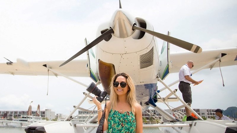 Happy travelers enjoy a seaplane Hanoi - Halong