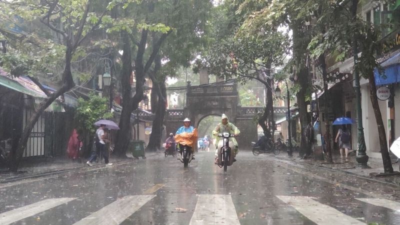 Always bring rain coach when travel to Vietnam during rainy season