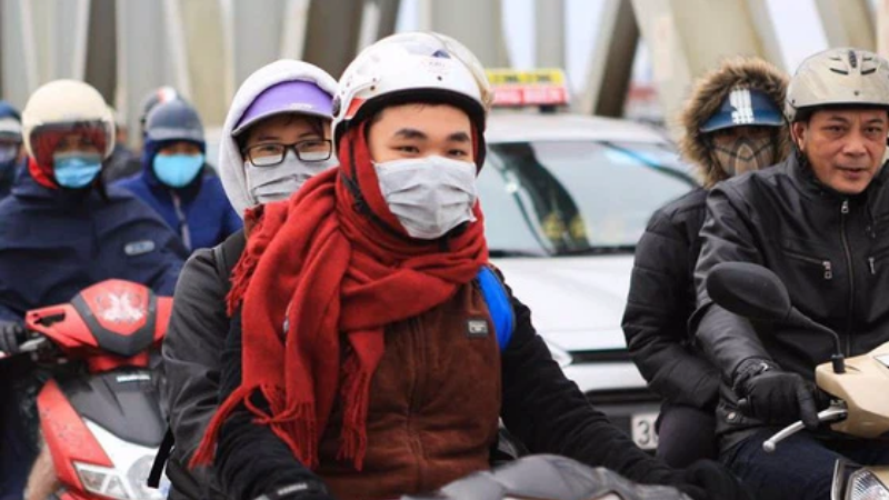 Local people bundle up - Hanoi weather January