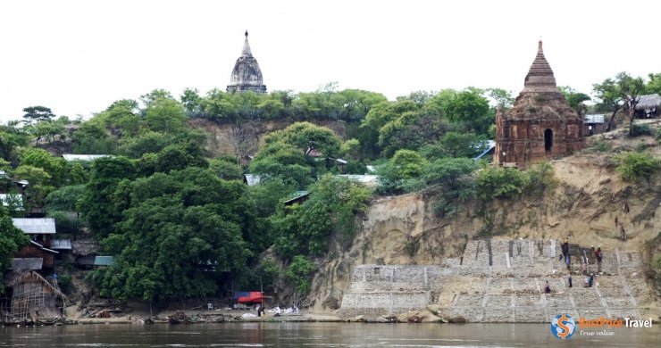 Villagers Fortify The Walls Of The Irrawaddy Riverbank In Bagan, Where A Pagoda Rests Dangerously Close To The Edge. Pagodas Dot Bagan’s Landscape Of Acacia Trees And F