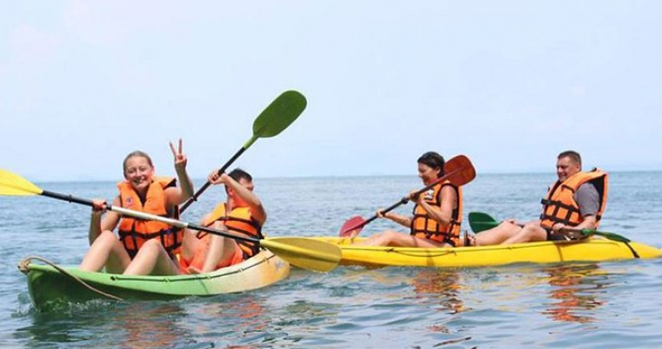 Tourists Cheerful With Kayaking Activity