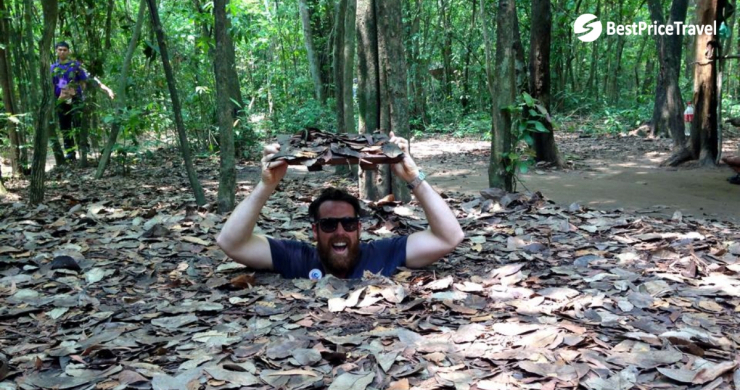 Visitor Is Cheerful When Discovering Cu Chi Tunnel