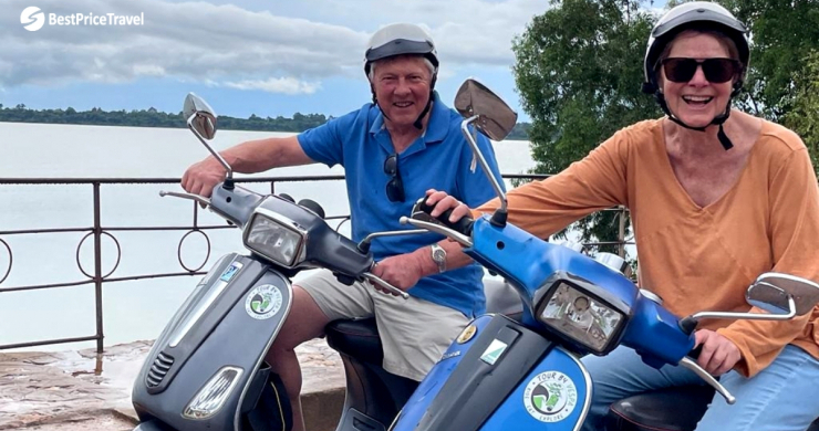 A Couple Is Cheerful While Driving Vespa Motorbikes For The First Time