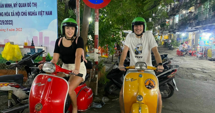 Visitors Feel Cheerful While Trying Vespa Motorbike