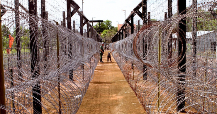 The Barbed Wire Fence Is Densely Packed At The Prison