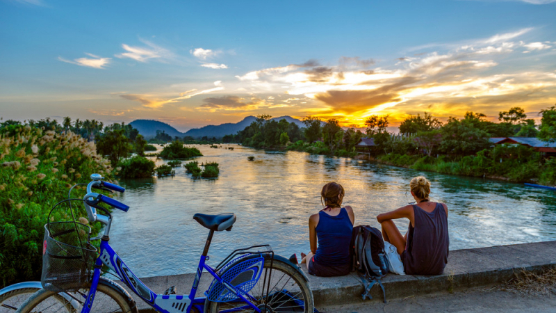 Tourists Looking At The Mekong River