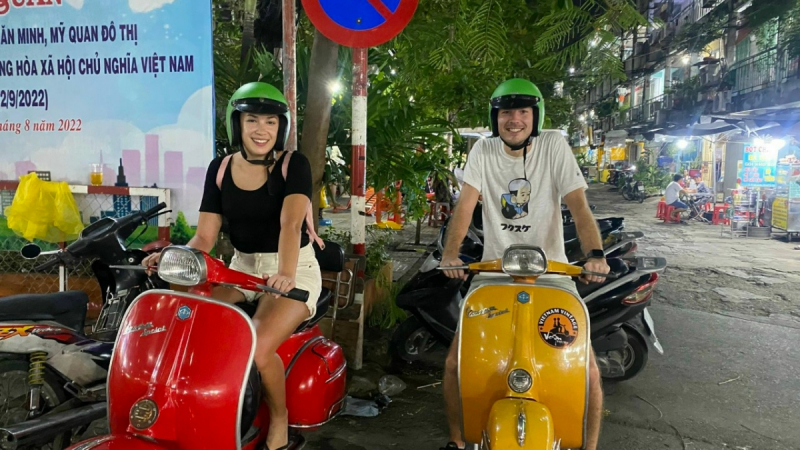 Visitors Feel Cheerful While Trying Vespa Motorbike