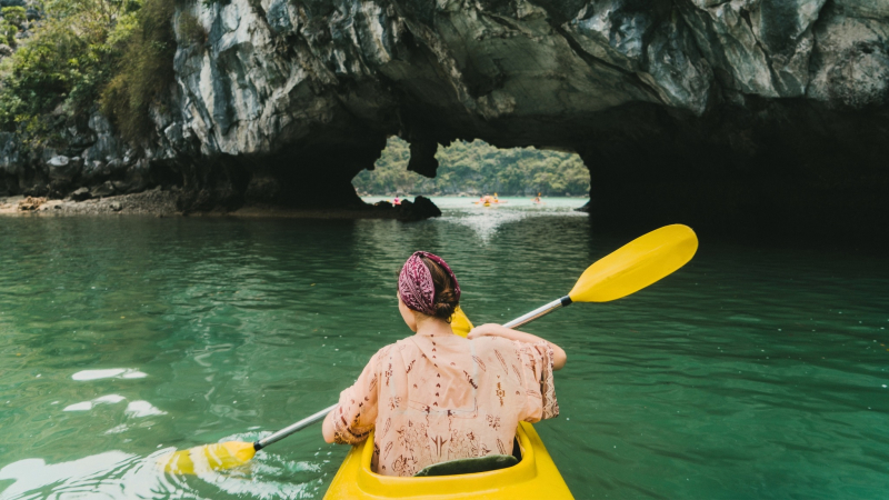 Kayak Through A Wet Cave In Halong Bay