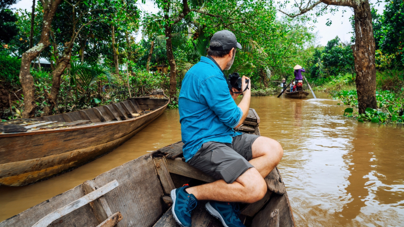 Sit On A Sampan Through Mekong Delta Canal