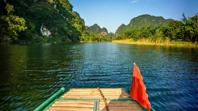 Admire The Lyrical Natural Scenery Of Ninh Binh While Riding A Bamboo Boat On The River