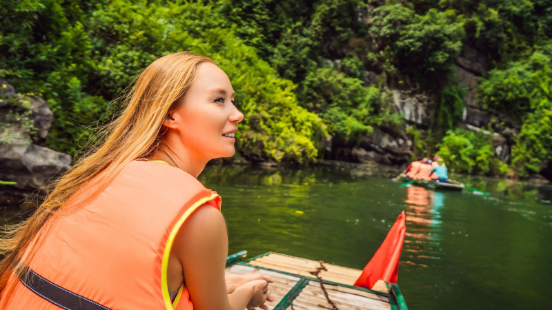 While Rowing Along The River, Take In The Natural Beauty Of The Mountains And Trees