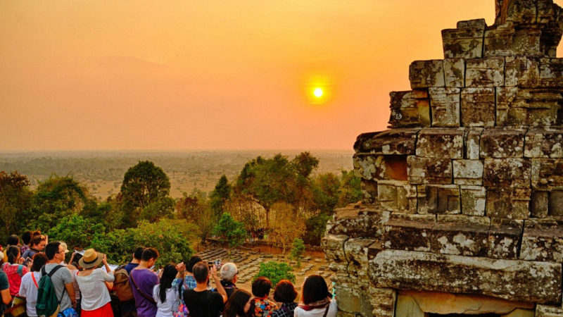 Tourists Stand At Bakheng Temple To Watch Sunset