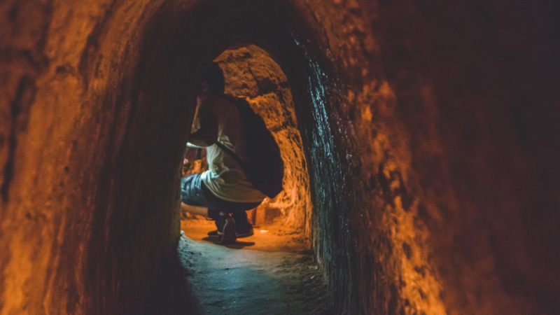 Tourists Explore The Cu Chi Tunnels