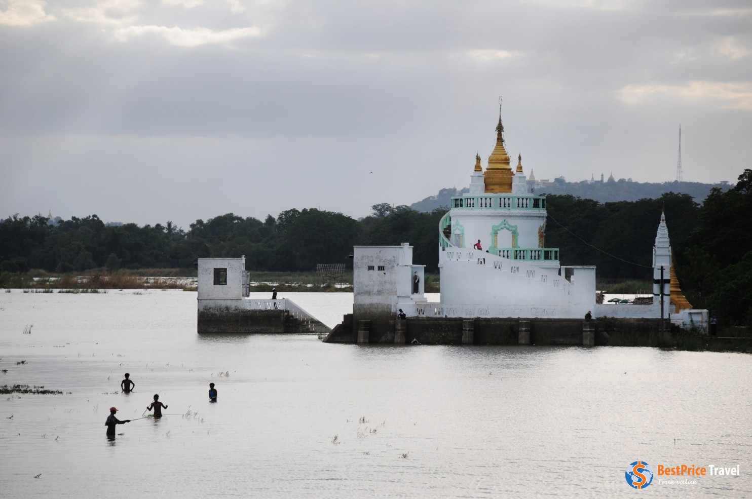 Fishermen Cast Their Lines Near A Pagoda On Taungthaman Lake In The City Of Mandalay.