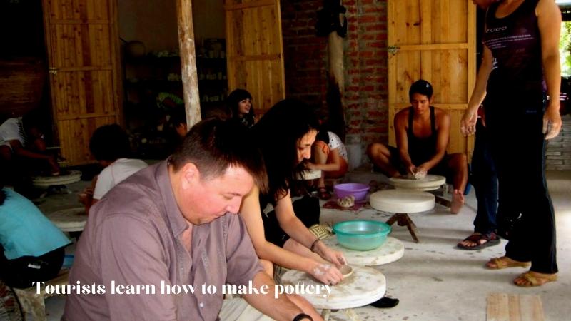 Tourists Learn How To Make Pottery