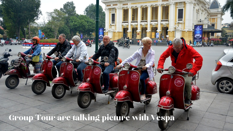 Group Tour Are Taking Pictures With Vespa
