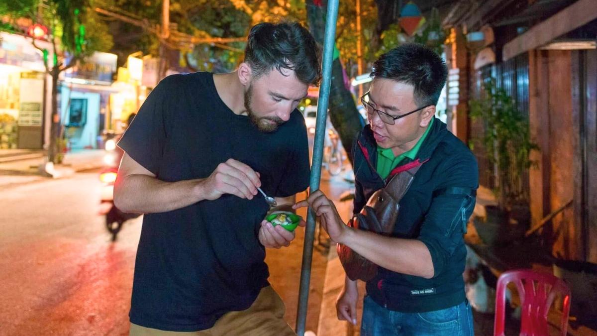 A tourist trying Balut for the first time