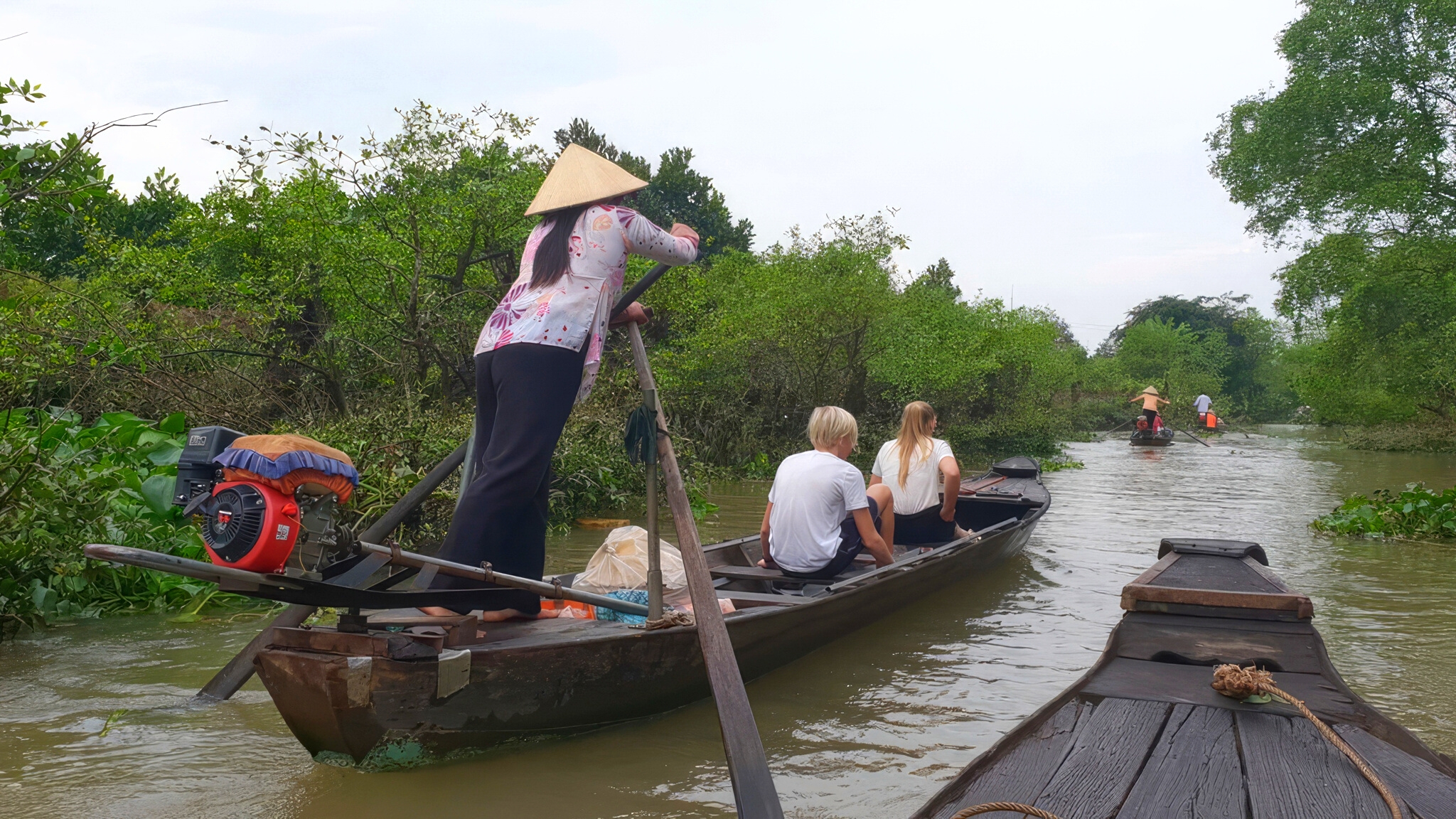 Rowing sampan to Tan Phong Islet